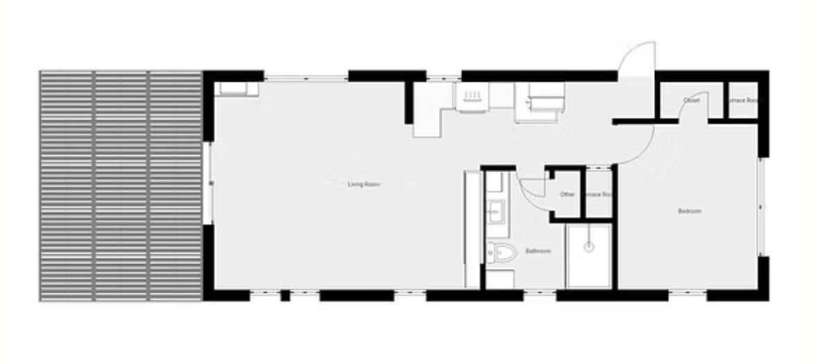 Floor plan of a single-story house featuring a living room, kitchen, bathroom, bedroom, and storage areas. Large windows suggest an open, airy design.
