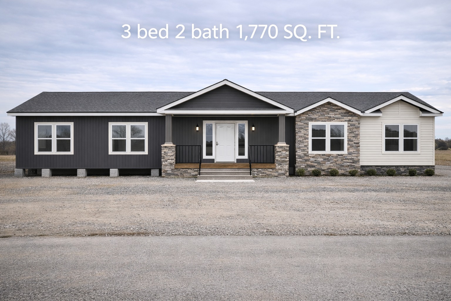 Single-story house with a mix of dark siding and stone accents. Three-bedroom, two-bath, 1,770 sq. ft., set against a cloudy sky.