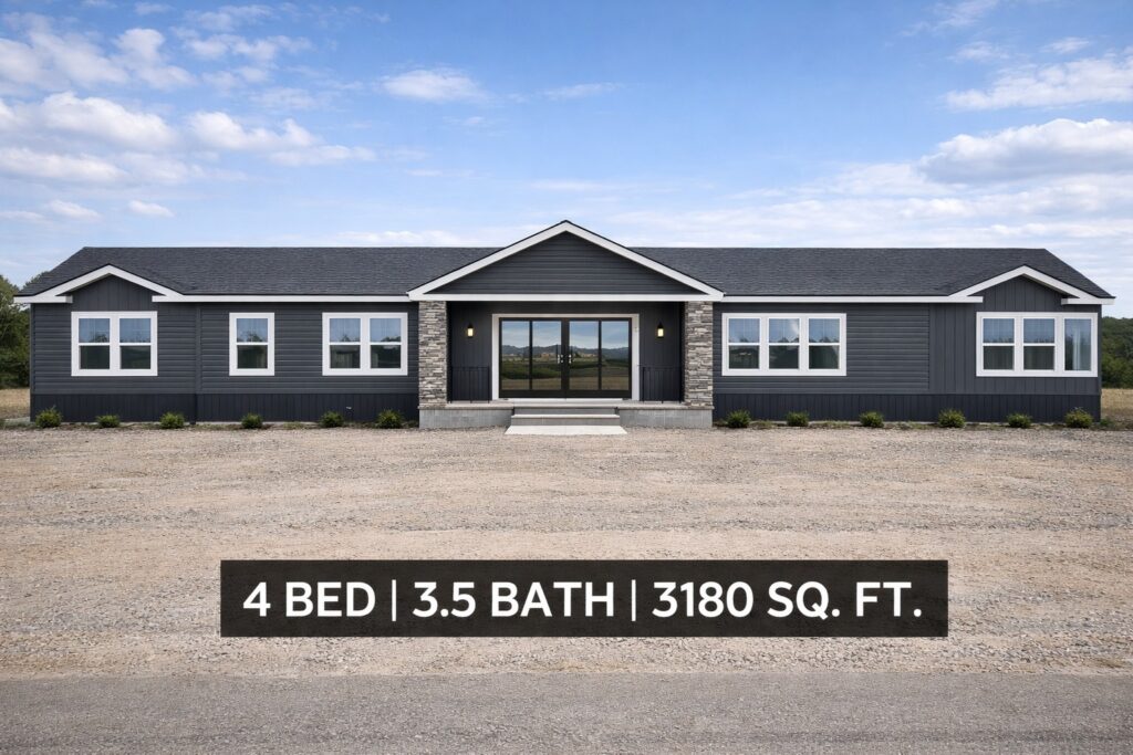 Spacious gray single-story house with multiple windows, surrounded by gravel, beneath a blue sky. Text overlay: "4 Bed | 3.5 Bath | 3180 Sq. Ft."