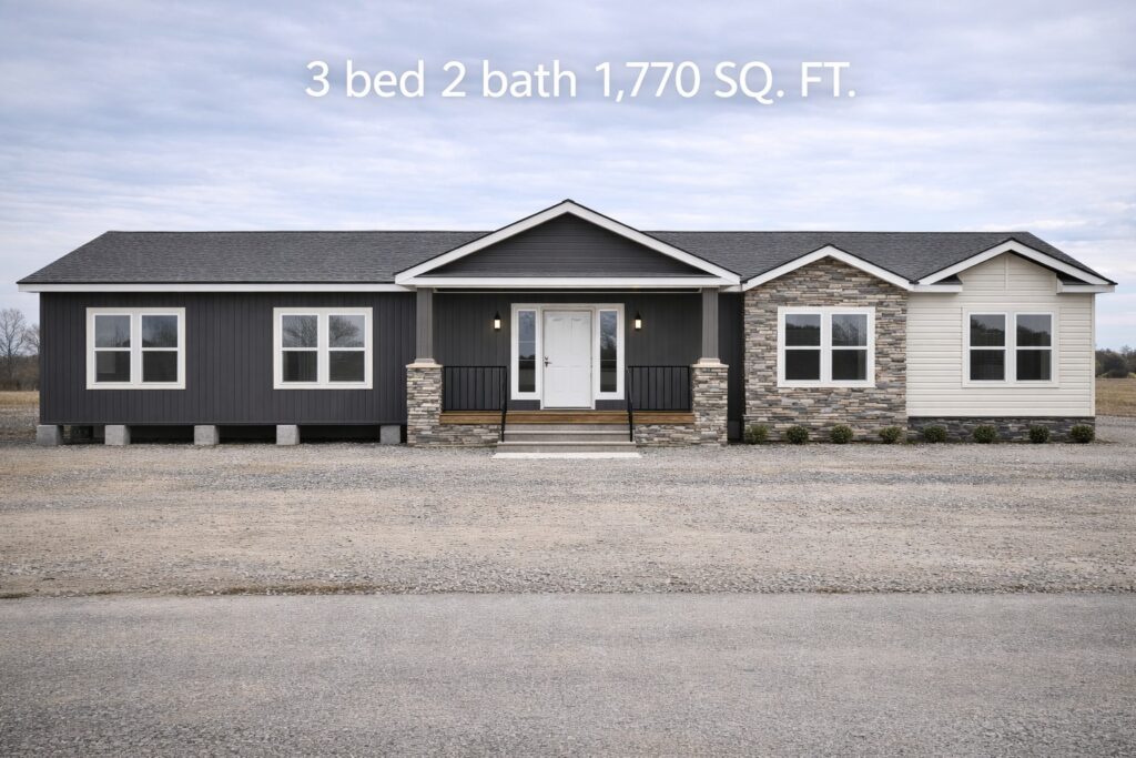 Single-story house with a mix of dark siding and stone accents. Three-bedroom, two-bath, 1,770 sq. ft., set against a cloudy sky.